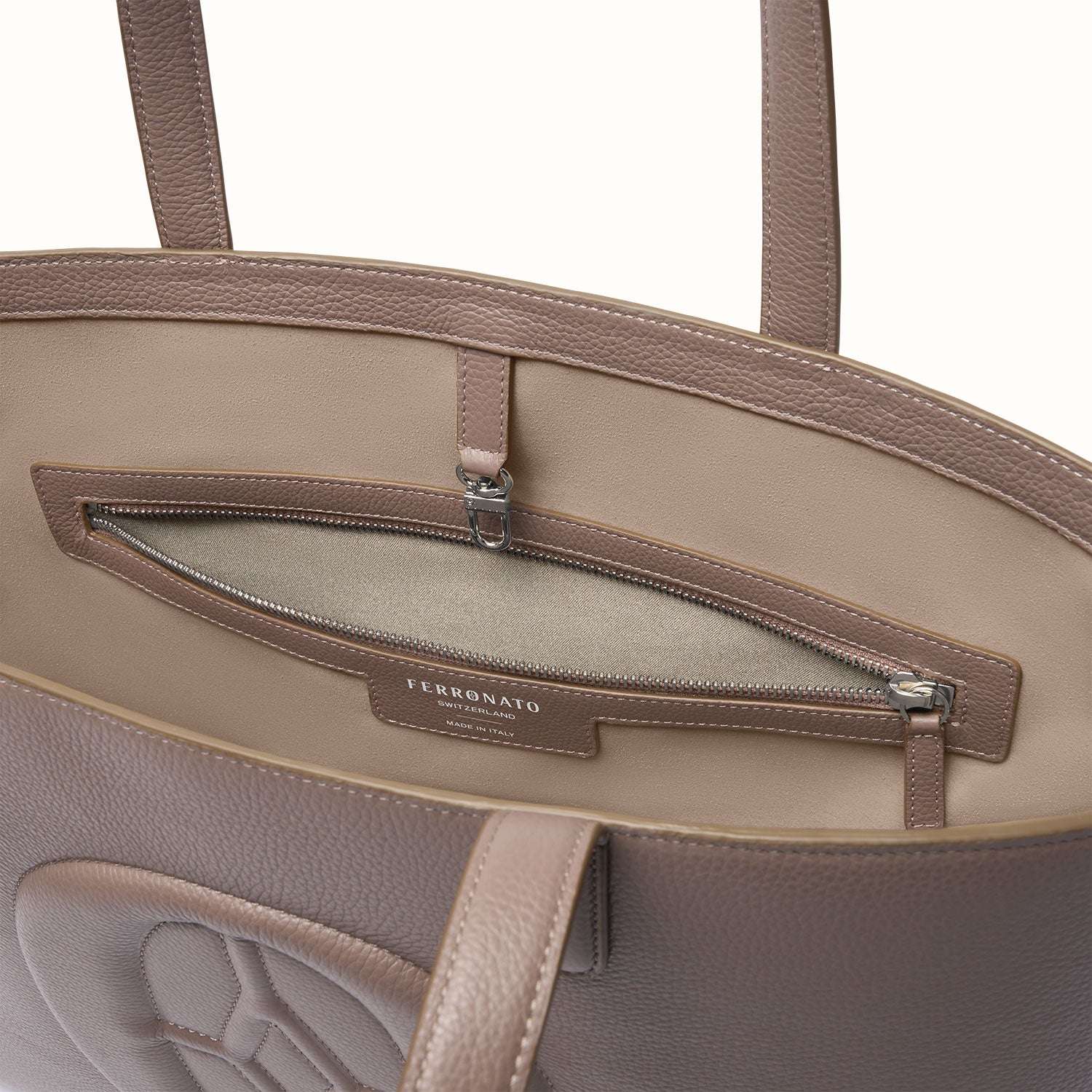 Sustainable Swiss travel handbag display #color_Serene Taupe